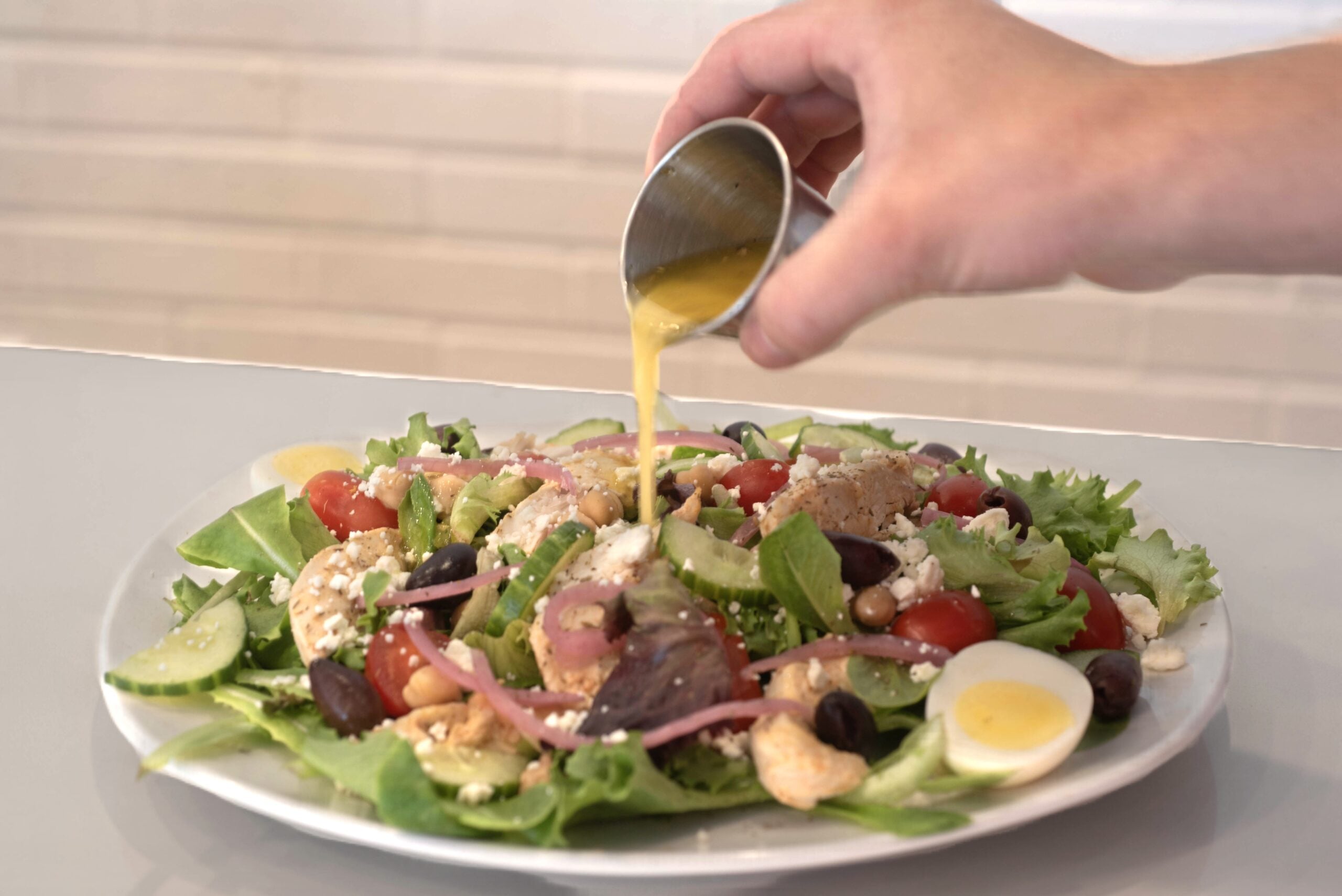 Healthy Salad seed oil free with 50g of protein at Rooted Cafe. House made salad dressing