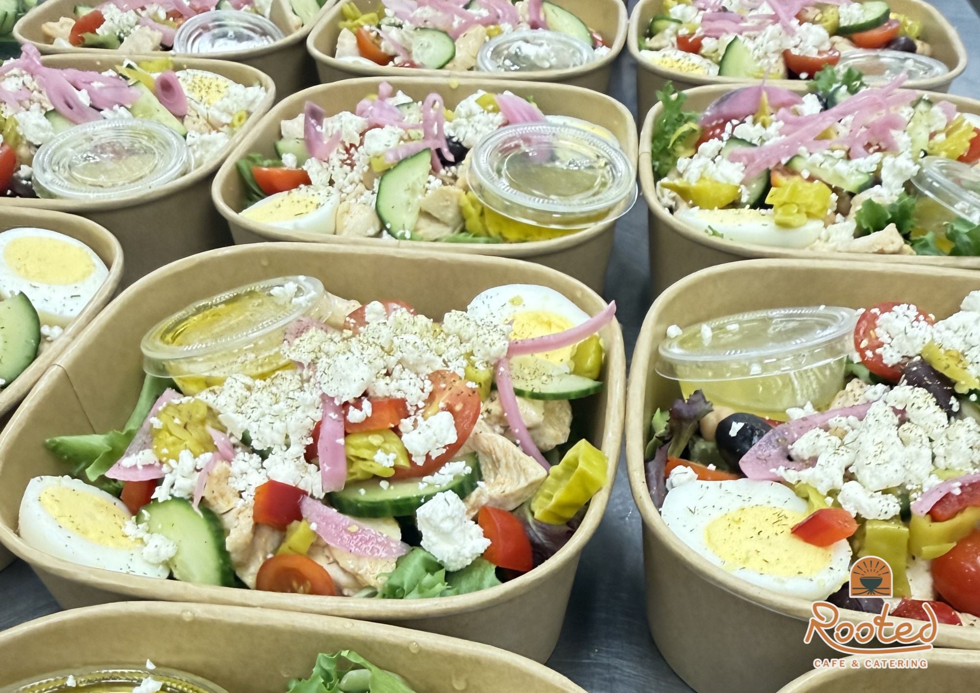 Catering display of individual salad meals. Perfect for a team meeting or feeding a large team.